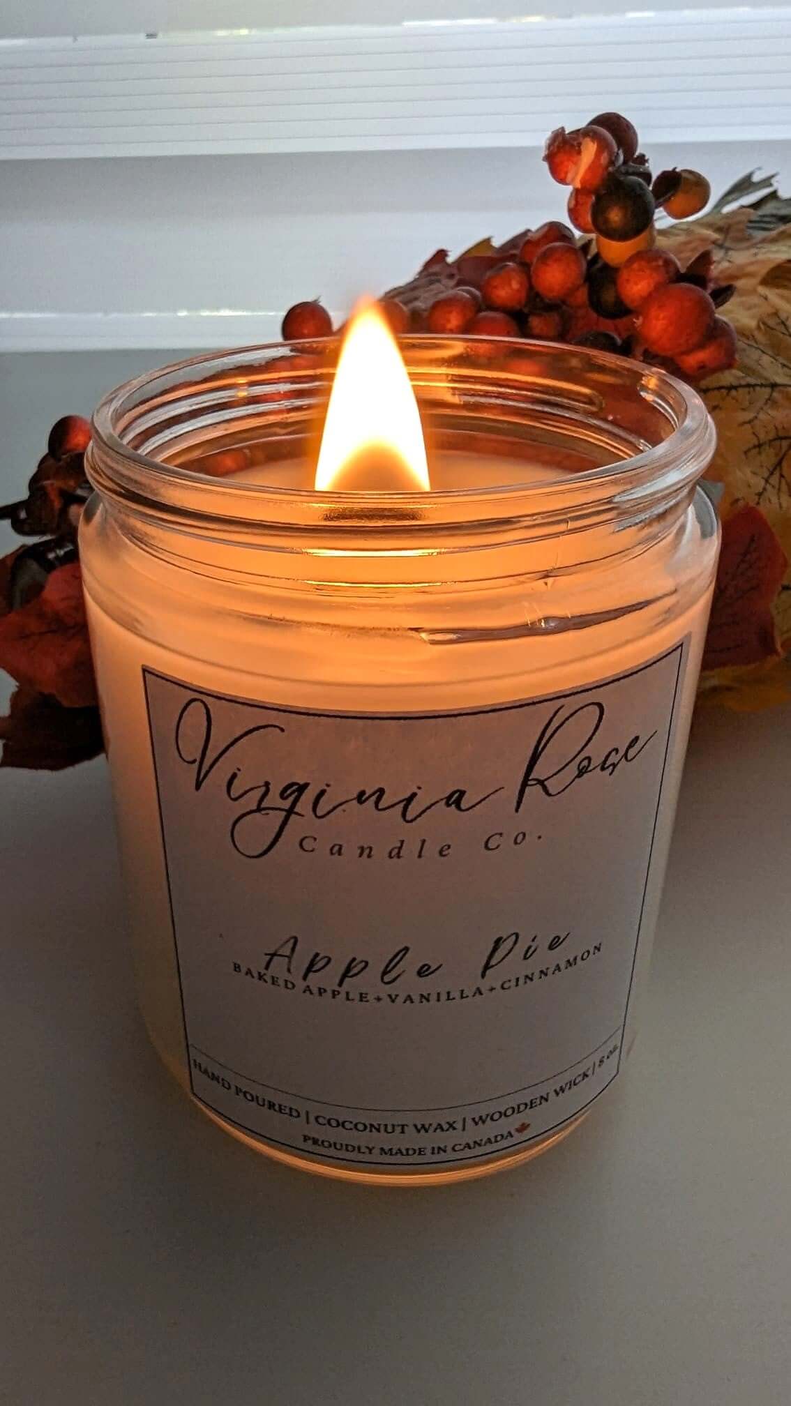 A lit Apple Pie Candle from Virginia Rose Candle Co.